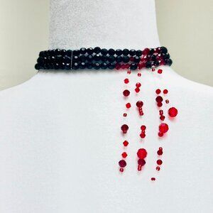 Black and red beaded choker necklace with a touch of gothic flair